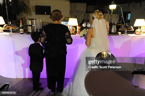 An Iranian bride takes part in a luxury wedding with mixed dancing and removal of headscarves, at a private garden tailor-made for the purpose west...