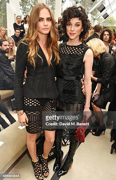 Cara Delevingne and Annie Clark attend the Burberry Womenswear Spring/Summer 2016 show during London Fashion Week at Kensington Gardens on September...