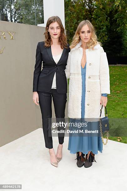 Amber Anderson and Suki Waterhouse arrive at Burberry Womenswear Spring/Summer 2016 show during London Fashion Week at Kensington Gardens on...