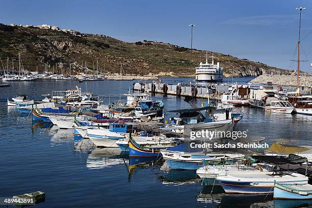 General view of fishing boats and the Gozo ferry in the Mgarr harbour basin on May 09, 2014 on Gozo Island, Malta.