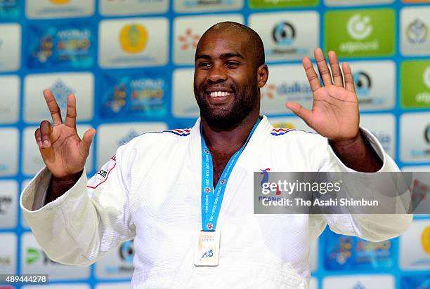 Gold medalist Teddy Riner of France celebrates on the podium at the medal ceremony for the Men's +100kg during the 2015 Astana World Judo...