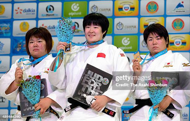 Silver medalist Megumi Tachimoto of Japan, gold medalist Yu Song of China and bronze medalist Kanae Yamabe of Japan pose on the podium at the medal...
