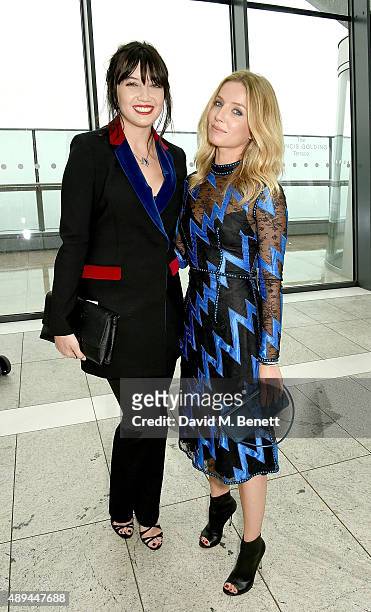 Daisy Lowe and Annabelle Wallis attend the Christopher Kane show during London Fashion Week SS16 at Sky Garden on September 21, 2015 in London,...