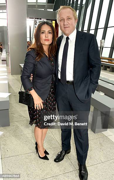 Salma Hayek and Francois-Henri Pinault attend the Christopher Kane show during London Fashion Week SS16 at Sky Garden on September 21, 2015 in...