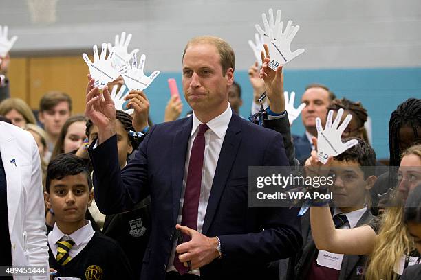 Prince William, Duke Of Cambridge takes part in a group exercise during his visit to Hammersmith Academy to support the Diana Award's Anti-bullying...