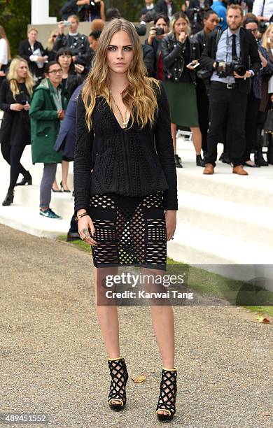 Cara Delevingne attends the Burberry Prorsum show during London Fashion Week Spring/Summer 2016/17 at Kensington Gardens on September 21, 2015 in...