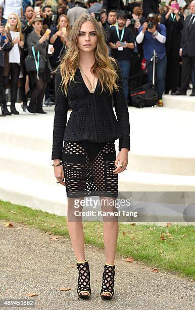 Cara Delevingne attends the Burberry Prorsum show during London Fashion Week Spring/Summer 2016/17 at Kensington Gardens on September 21, 2015 in...