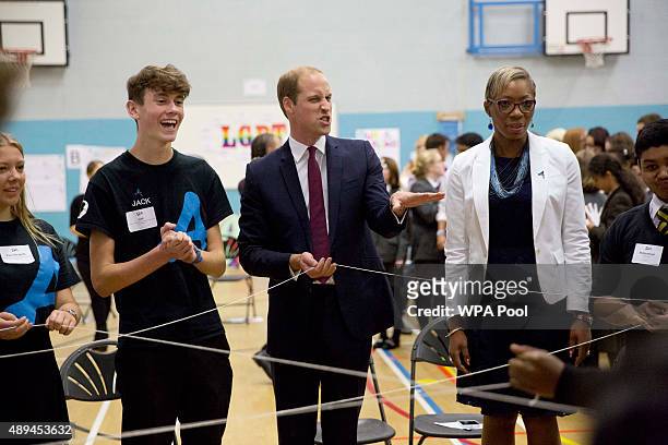 Prince William, Duke Of Cambridge takes part in a group exercise during his visit to Hammersmith Academy to support the Diana Award's Anti-bullying...
