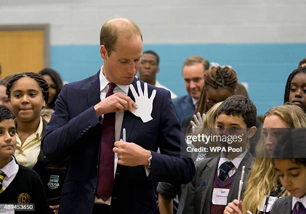 Prince William, Duke Of Cambridge takes part in a group exercise during his visit to Hammersmith Academy to support the Diana Award's Anti-bullying...