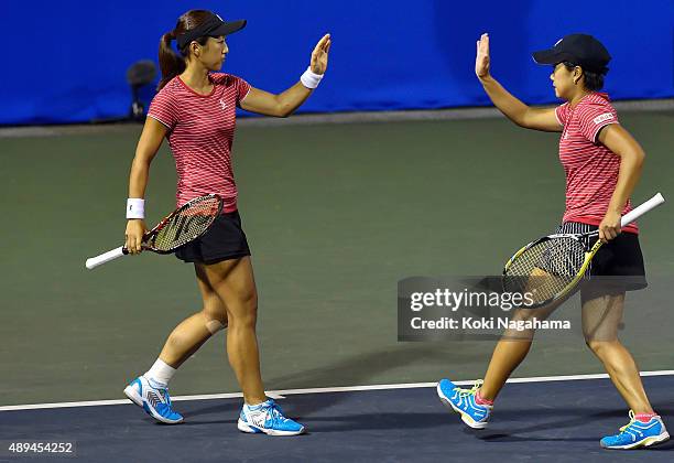 Misaki Doi and Kurumi Nara of Japan celebrate a point action during the women's doubles match against Raquel Kops-Jones and Abigail Spears of USA...