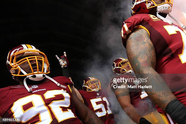 Inside linebacker Will Compton of the Washington Redskins, nose tackle Chris Baker of the Washington Redskins, guard Shawn Lauvao of the Washington...