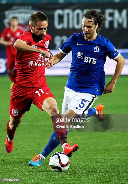 Vitali Dyakov of FC Dinamo Moscow is challenged by Marko Devic of FC Rubin Kazan during the Russian Premier League match between Dinamo Moscow and FC...