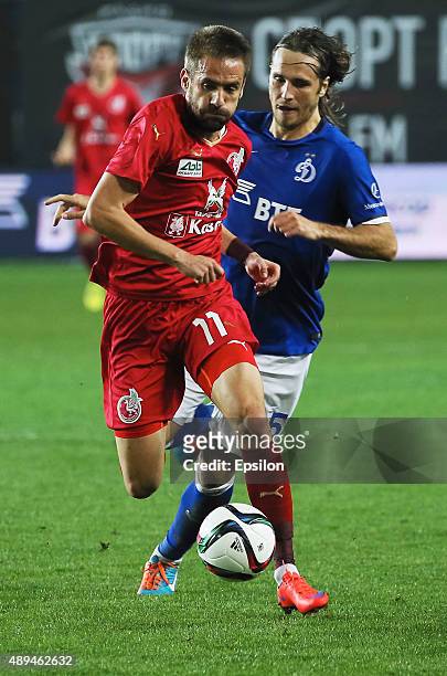Vitali Dyakov of FC Dinamo Moscow is challenged by Marko Devic of FC Rubin Kazan during the Russian Premier League match between Dinamo Moscow and FC...