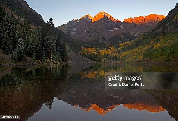 The Maroon Bells as seen from Maroon Lake near sunrise on September 20, 2015 in Aspen, Colorado.