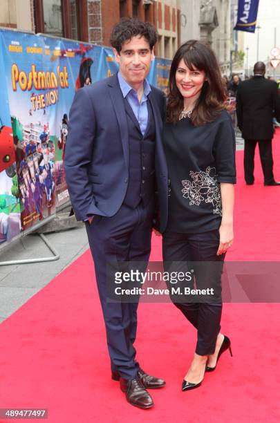 Stephen Mangan and Louise Delamere attend the World Premiere of "Postman Pat" at Odeon West End on May 11, 2014 in London, England.