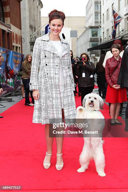 Ashleigh Butler and Pudsey attend the World Premiere of "Postman Pat" at Odeon West End on May 11, 2014 in London, England.