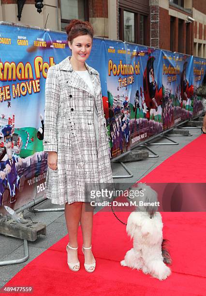 Ashleigh Butler and Pudsey attend the World Premiere of "Postman Pat" at Odeon West End on May 11, 2014 in London, England.