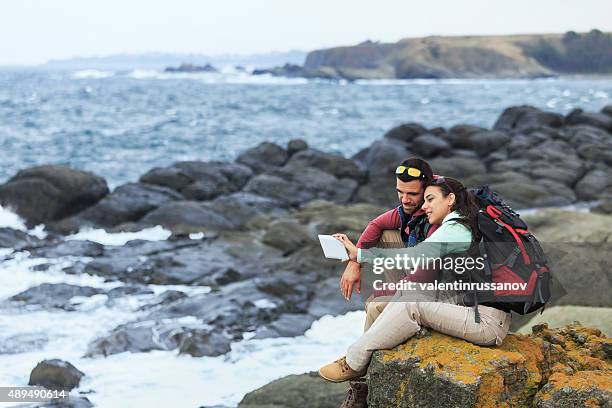 tourists with backpacks enjoying - men selfie wide stock pictures, royalty-free photos & images