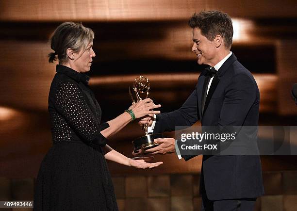 Actress Frances McDormand accepts Outstanding Lead Actress in a Limited Series or Movie for 'Olive Kitteridge' onstage from actor Rob Lowe during the...