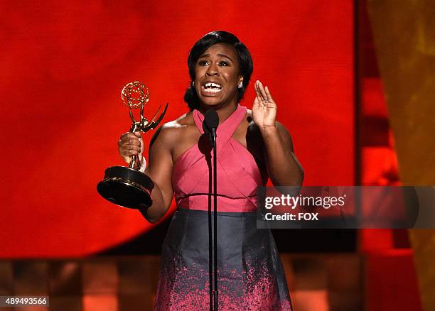 Actress Uzo Aduba accepts Outstanding Supporting Actress in a Drama Series for 'Orange Is the New Black' onstage during the 67th Annual Primetime...