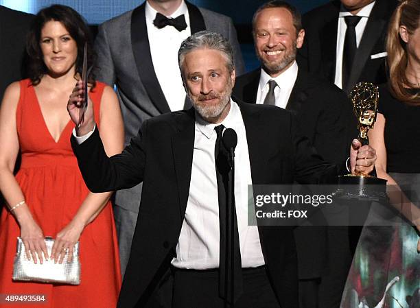 Personality Jon Stewart with cast and crew accept Outstanding Variety Talk Series award for 'The Daily Show with Jon Stewart' onstage during the 67th...