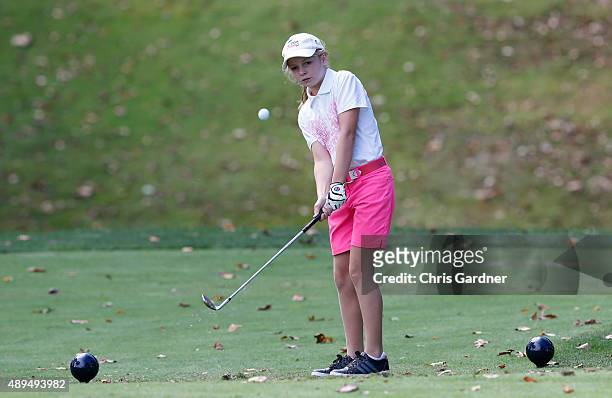 Stephanie Buchsbaum watches her chip during the Drive, Chip and Putt Tournament at the Congressional Country Club on September 20, 2015 in Bethesda,...