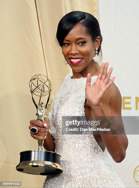 Regina King poses with her award for Outstanding Supporting Actress In A Limited Series Or A Movie in the photo room at the 67th Annual Primetime...