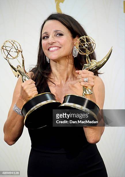 Julia Louis-Dreyfus poses with her Awards for "Veep" in the photo room at the 67th Annual Primetime Emmy Awards at the Microsoft Theater on September...