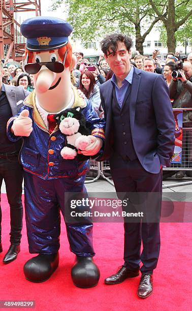 Postman Pat and Stephen Mangan attend the World Premiere of "Postman Pat" at Odeon West End on May 11, 2014 in London, England.