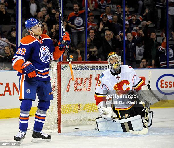 Leon Draisaitl of the Edmonton Oilers celebrates a goal against goalie Mason McDonald of the Calgary Flames at Rexall Place on September 21, 2015 in...