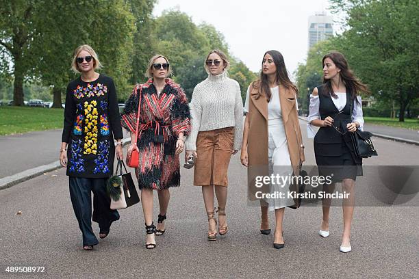 Fashion blogger Nina Swess wears Peter Pilotto dress, J Brand jeans, Gentle Monster sunglasses and Fendi bag. With fashion blogger Camila Carril...