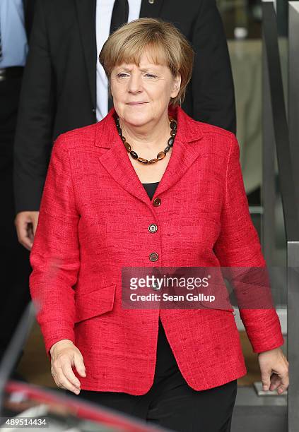 German Chancellor Angela Merkel departs after speaking at the presentation of former Chancellor Gerhard Schroeder's biography on September 22, 2015...