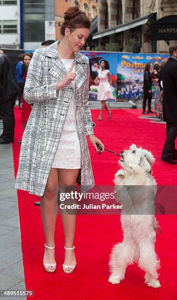 Ashleigh Butler and Pudsey attends the UK Premiere of "Postman Pat" at Odeon West End on May 11, 2014 in London, England.