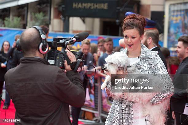 Ashleigh Butler and Pudsey attends the UK Premiere of "Postman Pat" at Odeon West End on May 11, 2014 in London, England.