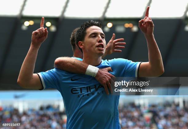 Samir Nasri of Manchester City celebrates scoring the first goal during the Barclays Premier League match between Manchester City and West Ham United...