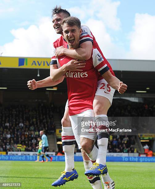 Arsenal's Aaron Ramsey celebrates his goal with Carl Jenkinson during the Barclays Premier League match between Norwich City and Arsenal at Carrow...