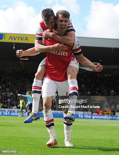 Arsenal's Aaron Ramsey celebrates his goal with Carl Jenkinson during the Barclays Premier League match between Norwich City and Arsenal at Carrow...