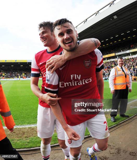 Carl Jenkinson celebrates scoring the 2nd Arsenal goal with Olivier Giroud during the Barclays Premier League match between Norwich City and Arsenal...