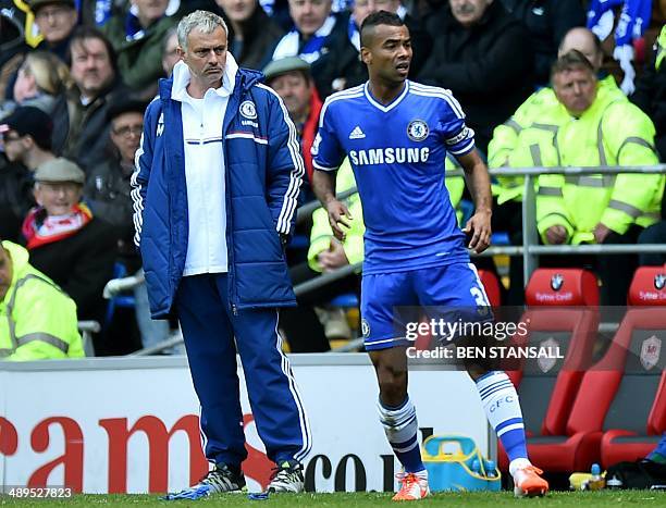 Chelsea's Portuguese manager Jose Mourinho looks towards Chelsea's English defender Ashley Cole during the English Premier League football match...