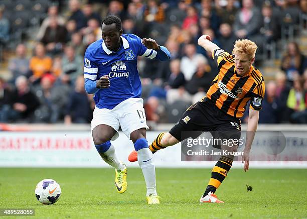 Romelu Lukaku of Everton takes on Paul McShane of Hull City on the way to scoring during the Barclays Premier League match between Hull City and...