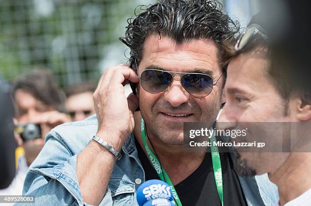 Alberto Tomba of Italy speaks with Max Biaggi of Italy on the grid during the Race 2 of World Superbikes - Race at Enzo & Dino Ferrari Circuit on May...