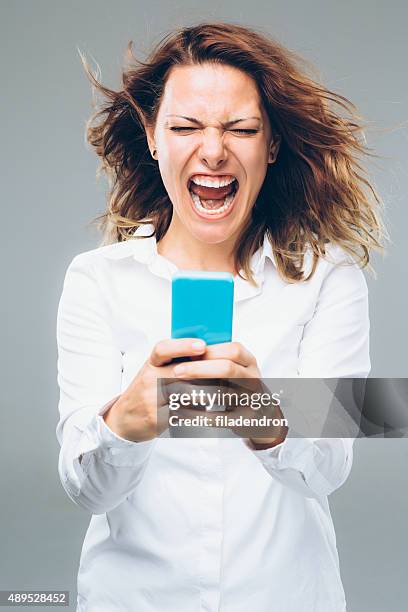 fast internet - shouting phone stock pictures, royalty-free photos & images