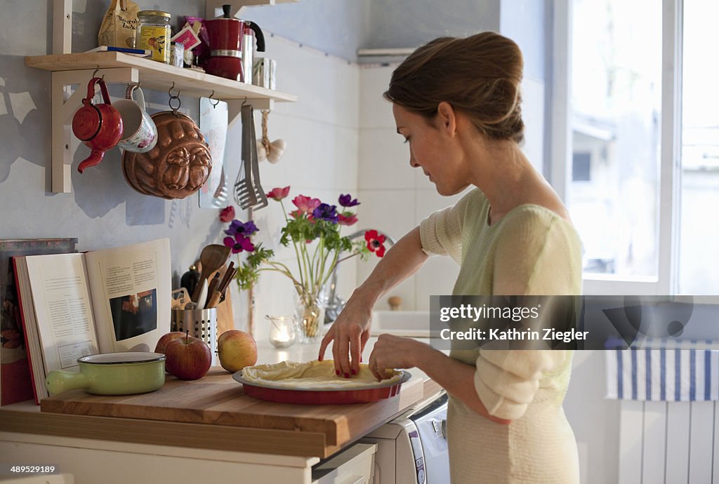 Woman making apple tart