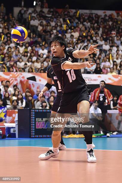 Yuta Yoneyama of Japan receives in the match between Japan and Poland during the FIVB Men's Volleyball World Cup Japan 2015 at Yoyogi National...