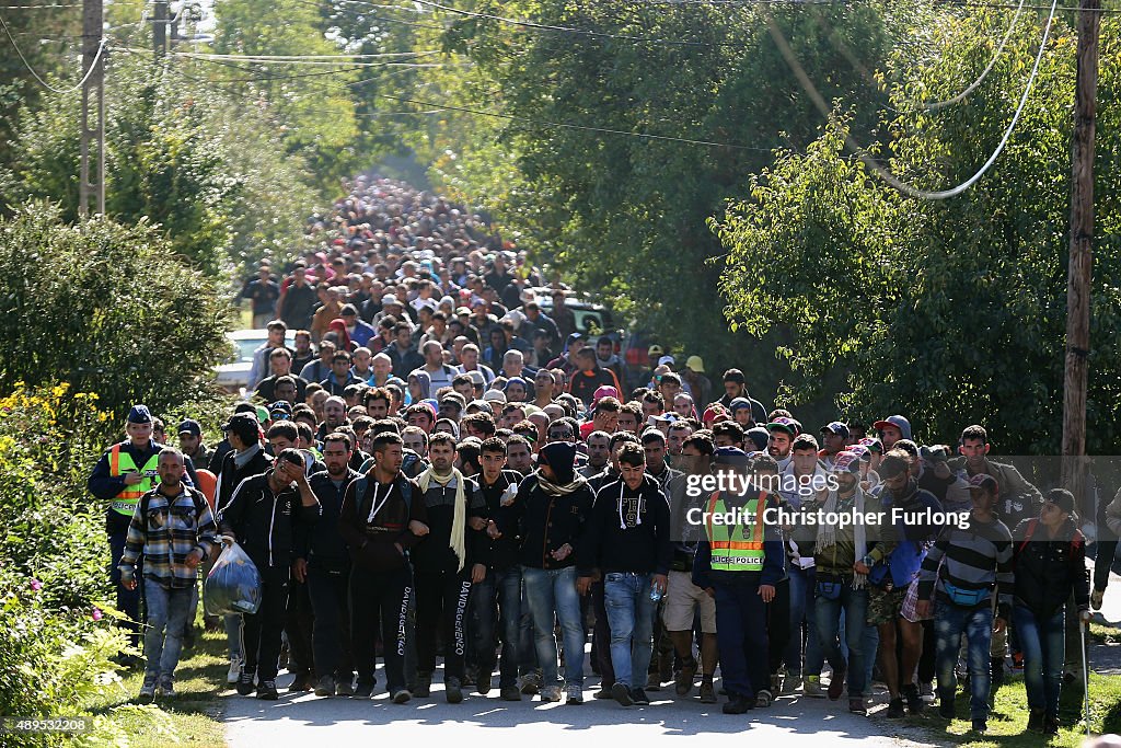 Migrants Cross From Hungary Into Austria On Route To Northern Europe