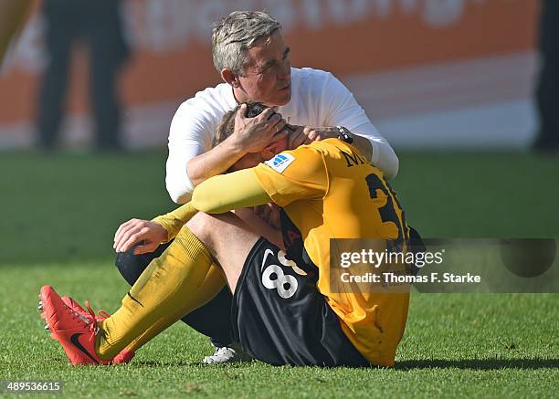 Head coach Olaf Janssen and Tobias Mueller of Dresden look dejected after loosing the Second Bundesliga match between Dynamo Dresden and Arminia...