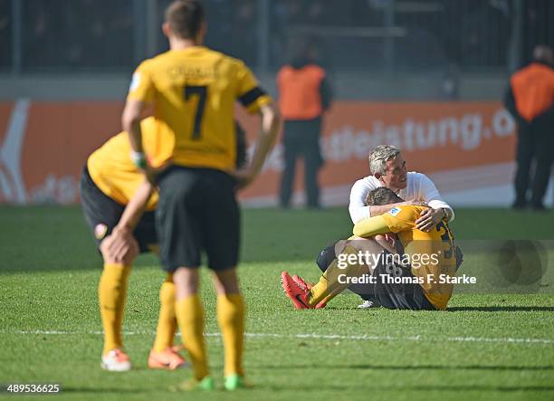 Head coach Olaf Janssen and Tobias Mueller of Dresden look dejected after loosing the Second Bundesliga match between Dynamo Dresden and Arminia...