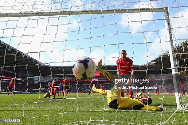 David Marshall the goalkeeper of Cardiff City is left grounded after Andre Schurrle of Chelsea scores the equalising goal during the Barclays Premier...