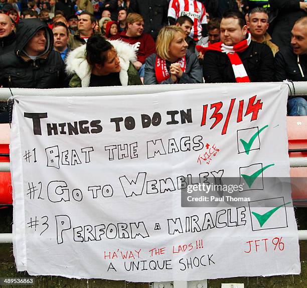 Sunderland fans show a banner celebrating their season after the Barclays Premier League match between Sunderland and Swansea City at Stadium of...