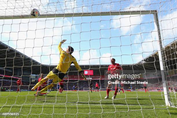 David Marshall the goalkeeper of Cardiff City is beaten by a shot from Andre Schurrle of Chelsea conceding the equalising goal during the Barclays...